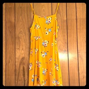 Casual yellow summer dress. With flowers.
